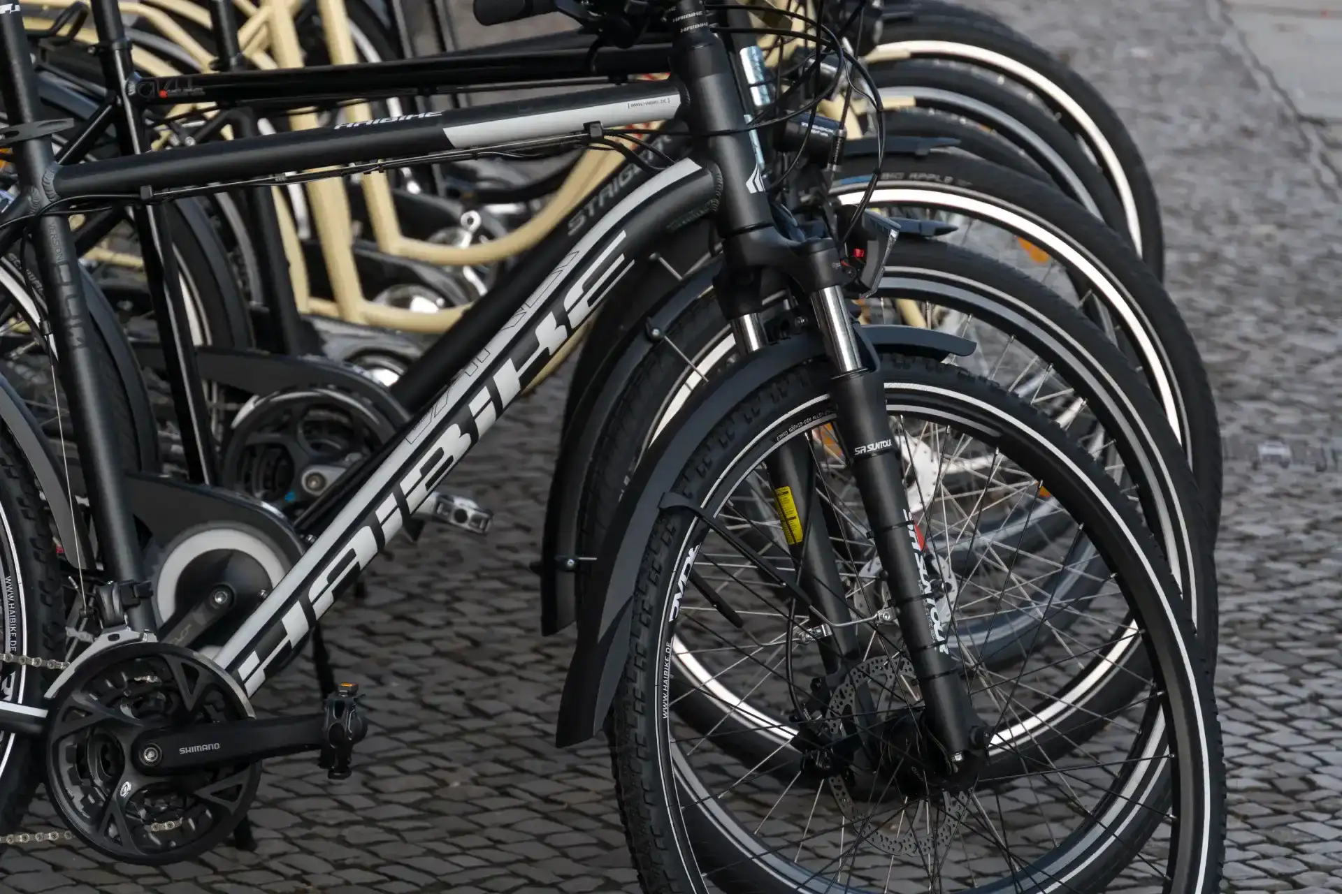 stacked black sport bicycles ready for use