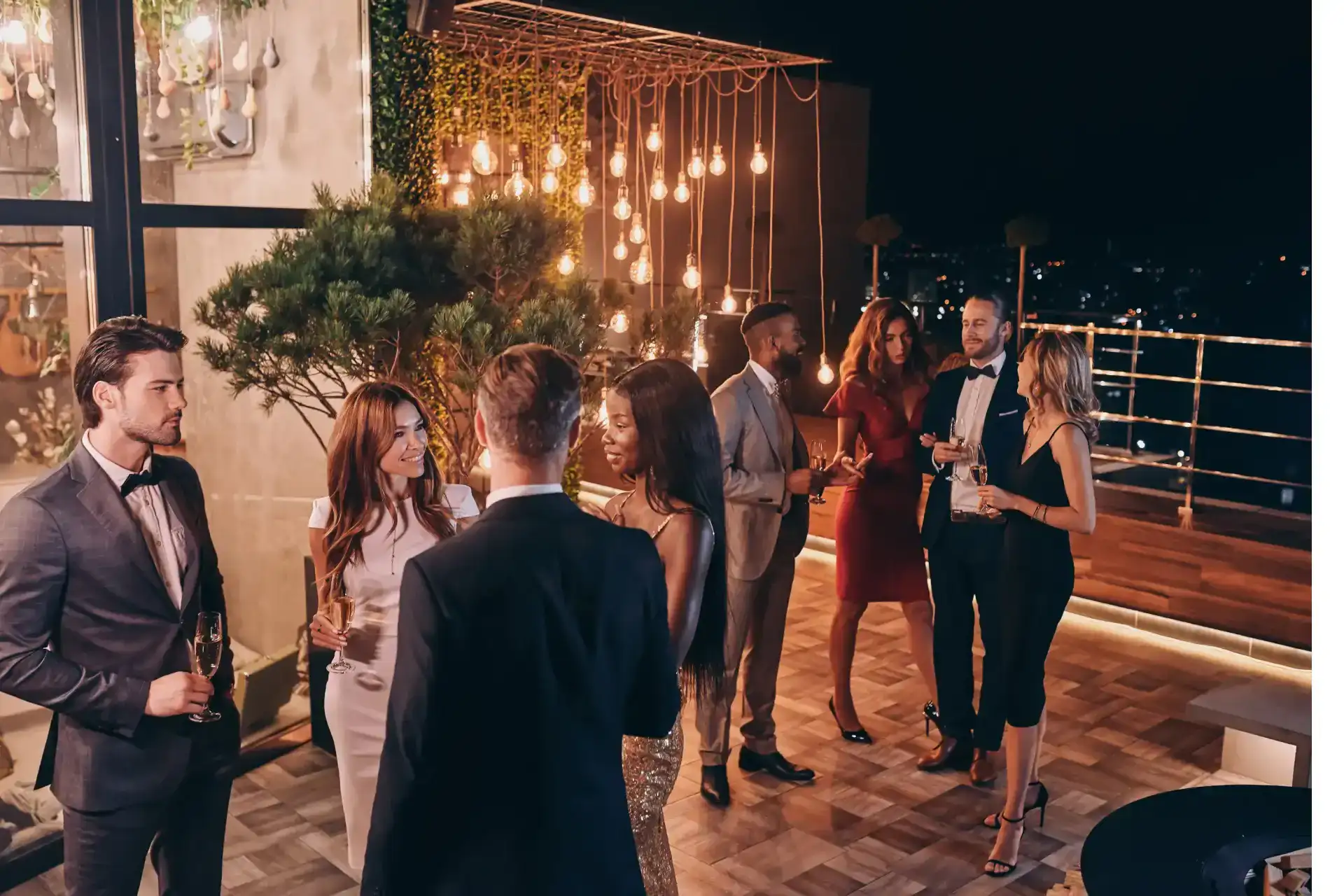 formal rooftop gathering with people wearing suits and dresses