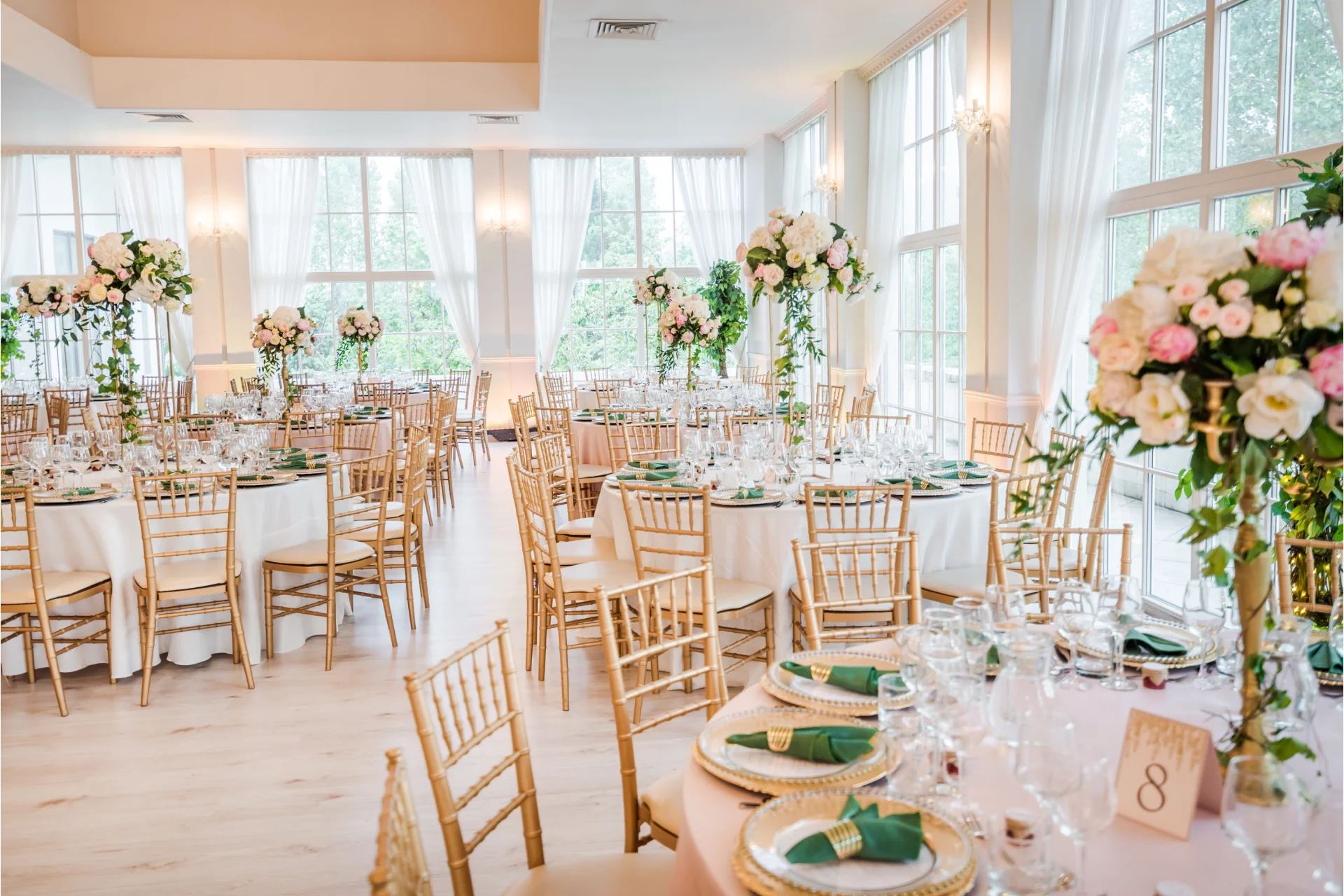 Beautifully decorated event space with elegant lighting and table settings